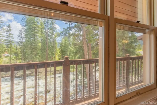 a bedroom with a large bed and a large window
