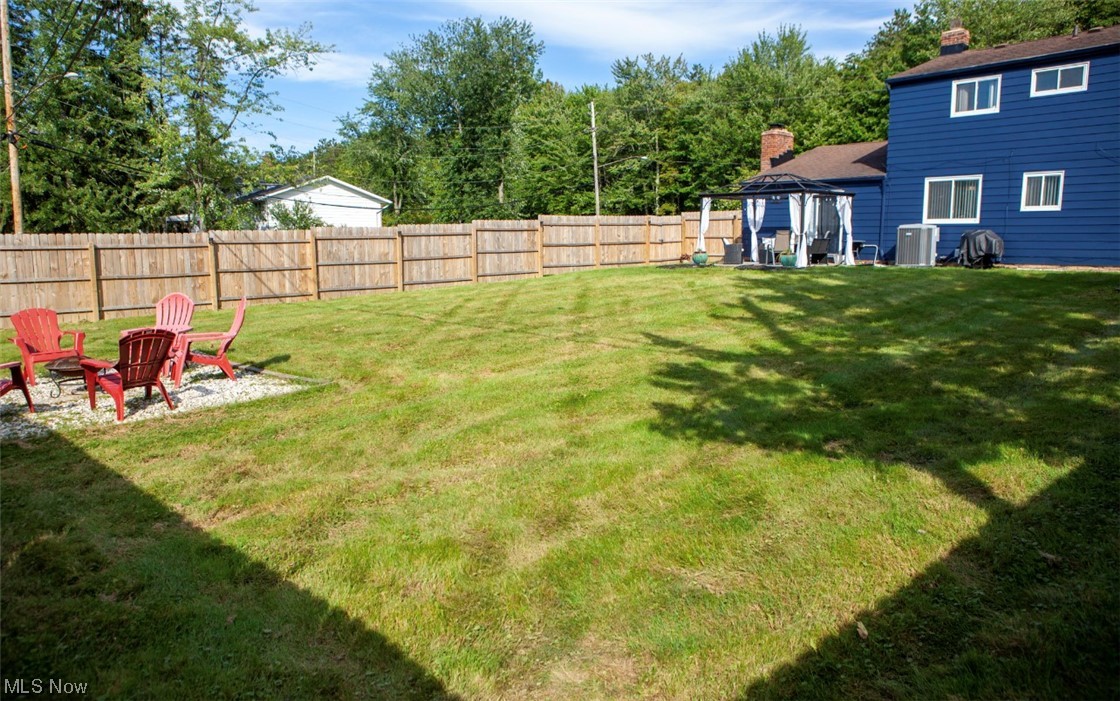 519 Button Road Bedford, OH 44146 - Photo 25 of 26 View of yard featuring a patio and a firepit
