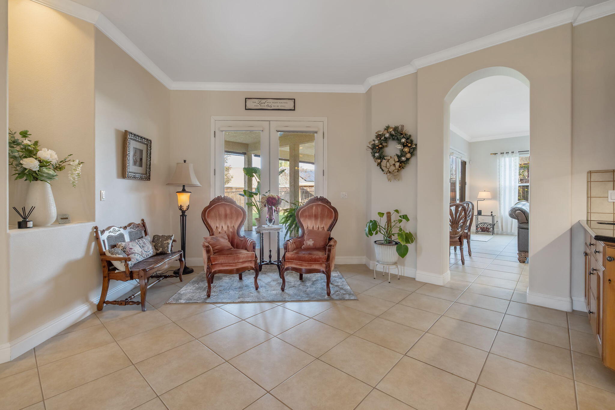 729 St Thomas Court Exeter, CA 93221 - Photo 11 of 66 a living room with couches and a dining table with wooden floor