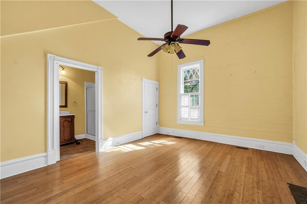 265 Kudzu Road Jenkinsburg, GA 30234 - Photo 13 of 38 a view of an empty room with wooden floor and a window