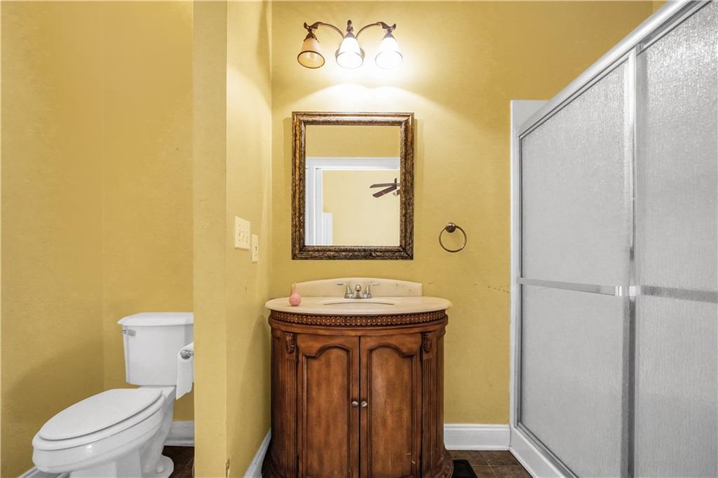 265 Kudzu Road Jenkinsburg, GA 30234 - Photo 14 of 38 a bathroom with a sink a toilet and mirror
