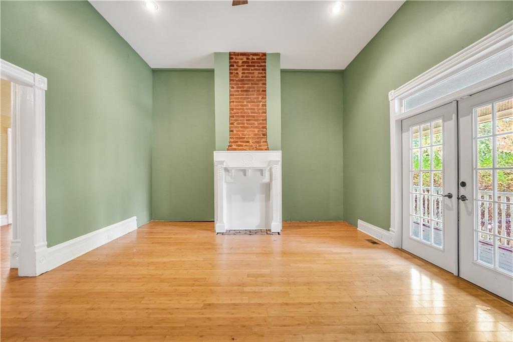 265 Kudzu Road Jenkinsburg, GA 30234 - Photo 15 of 38 a view of an empty room with wooden floor and a window