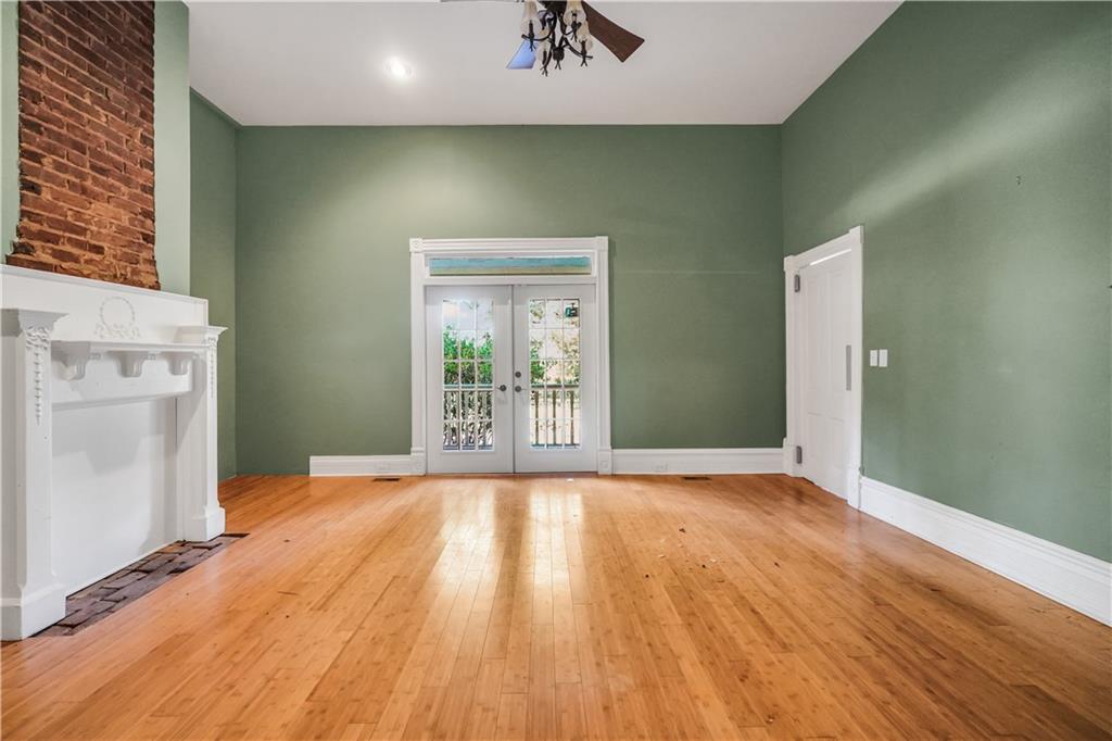 265 Kudzu Road Jenkinsburg, GA 30234 - Photo 16 of 38 a view of an empty room with window and wooden floor