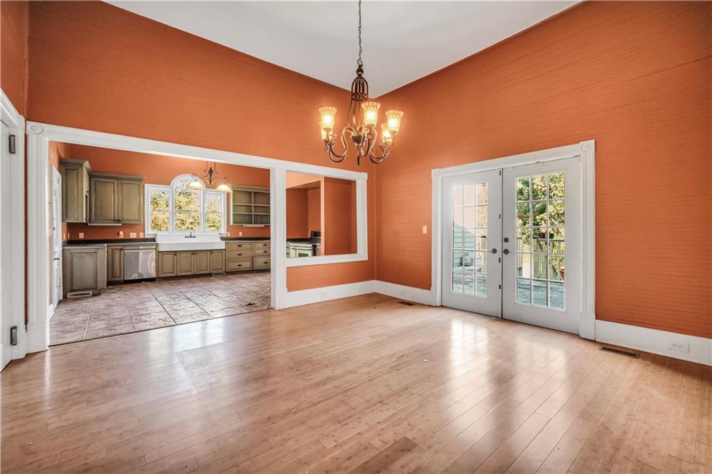 265 Kudzu Road Jenkinsburg, GA 30234 - Photo 17 of 38 a view of an empty room with window and wooden floor