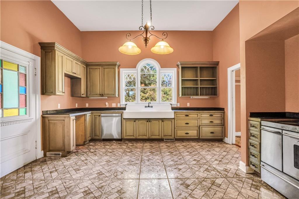 265 Kudzu Road Jenkinsburg, GA 30234 - Photo 18 of 38 a large bathroom with a granite countertop double vanity sink a mirror and a bathtub
