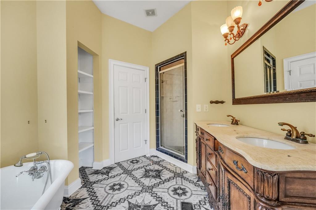 265 Kudzu Road Jenkinsburg, GA 30234 - Photo 25 of 38 a bathroom with a sink and a mirror