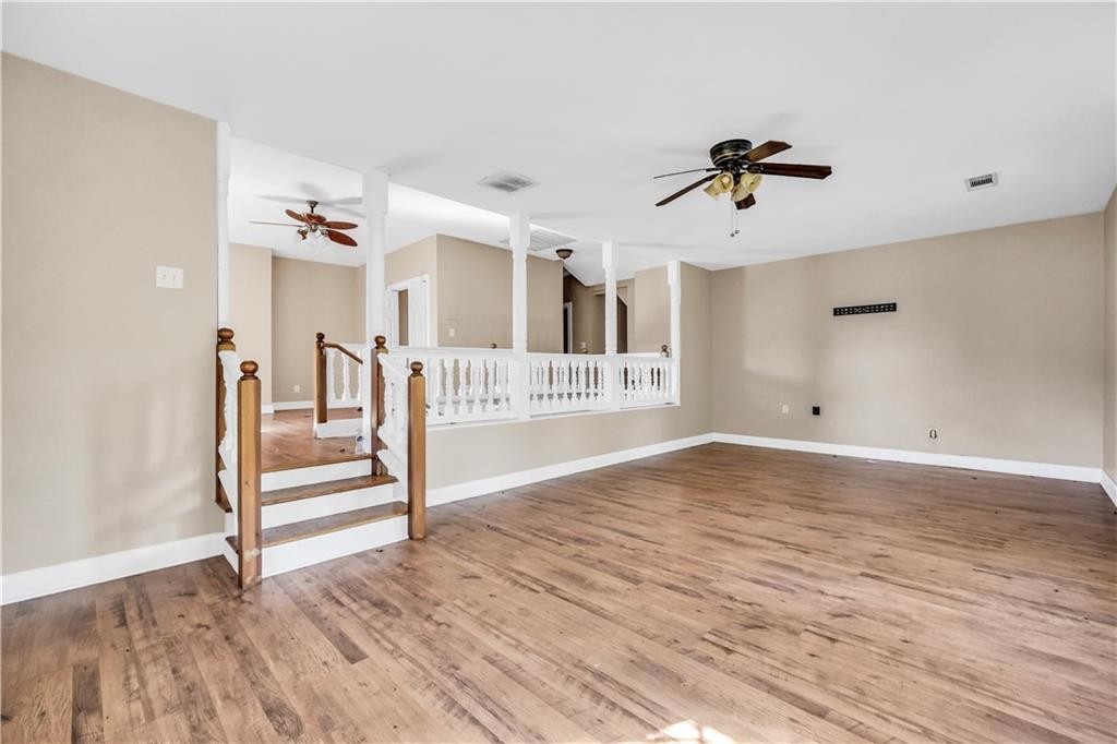 265 Kudzu Road Jenkinsburg, GA 30234 - Photo 26 of 38 a view of a livingroom with wooden floor and white walls