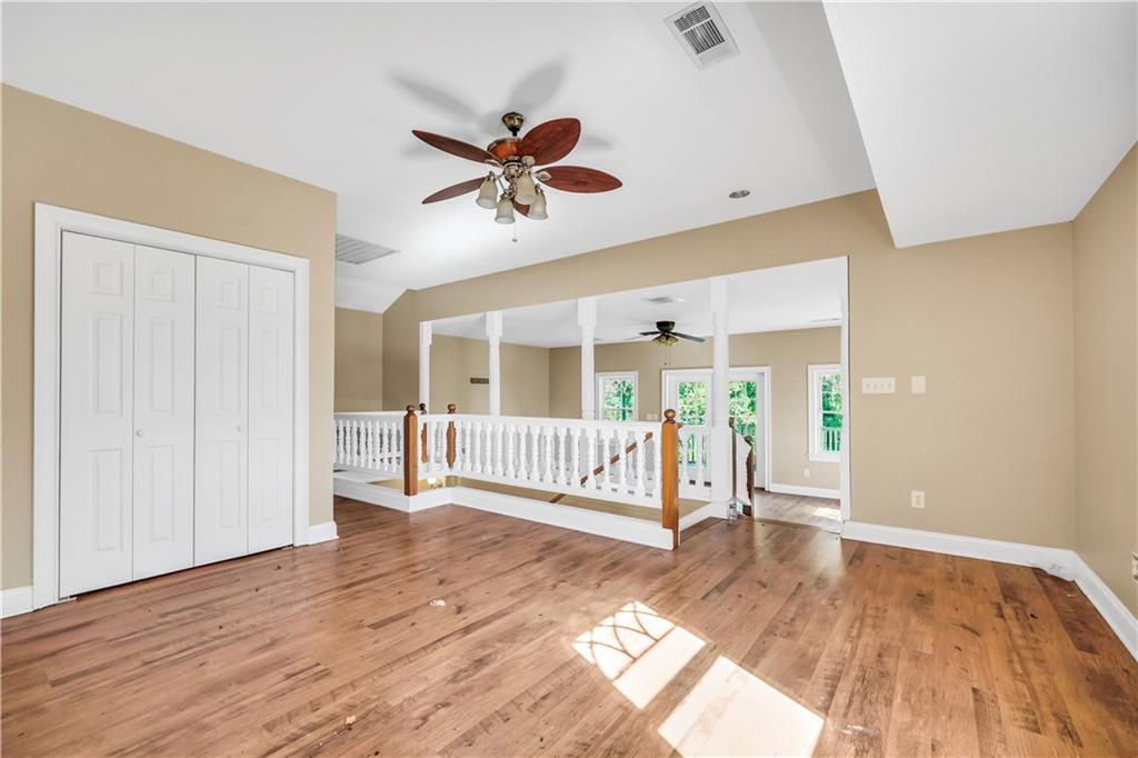 265 Kudzu Road Jenkinsburg, GA 30234 - Photo 28 of 38 a view of an empty room with wooden floor