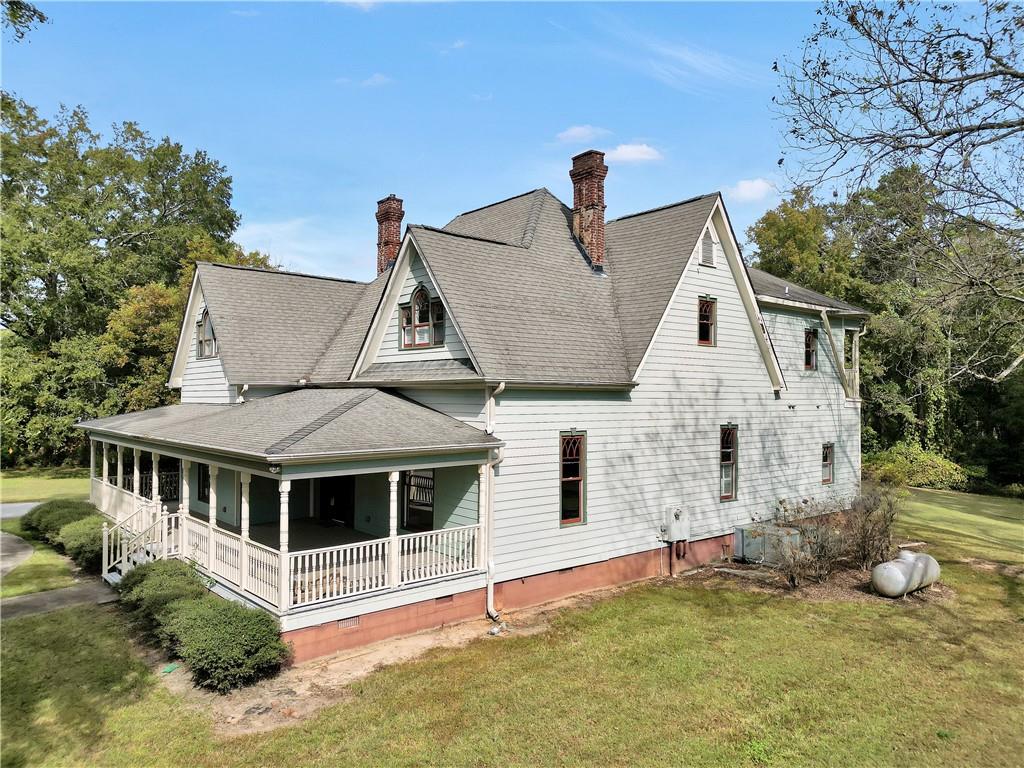 265 Kudzu Road Jenkinsburg, GA 30234 - Photo 30 of 38 a front view of a house with a yard