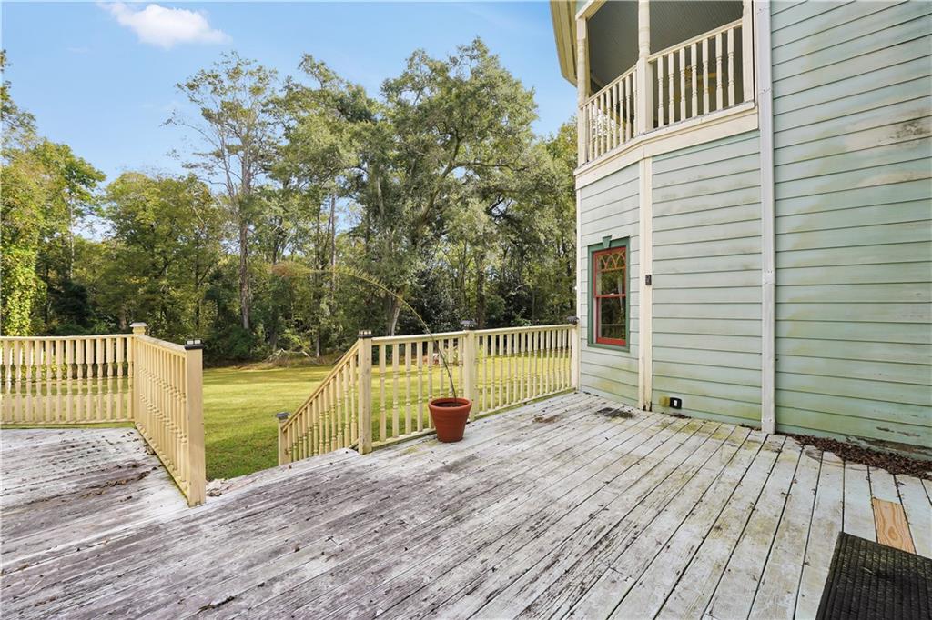 265 Kudzu Road Jenkinsburg, GA 30234 - Photo 37 of 38 a view of a balcony with wooden floor