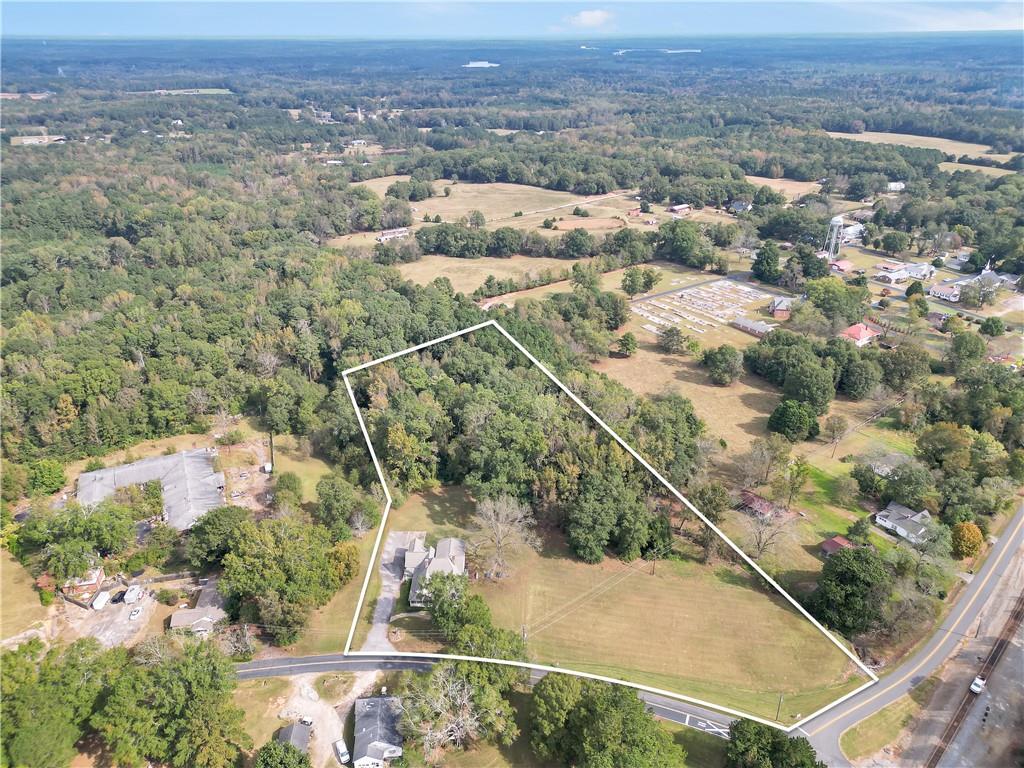 265 Kudzu Road Jenkinsburg, GA 30234 - Photo 4 of 38 an aerial view of a house with a yard
