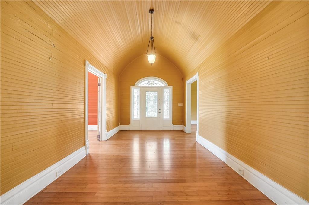 265 Kudzu Road Jenkinsburg, GA 30234 - Photo 5 of 38 a view of an empty room with wooden floor and a window