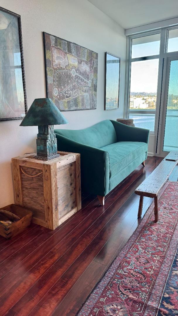 1 Lakeside Drive, Unit 602 Oakland, CA 94612 - Photo 11 of 26 a living room with furniture and a window