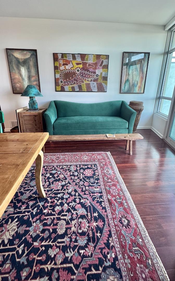 1 Lakeside Drive, Unit 602 Oakland, CA 94612 - Photo 12 of 26 a living room with rug couches cushion and a window