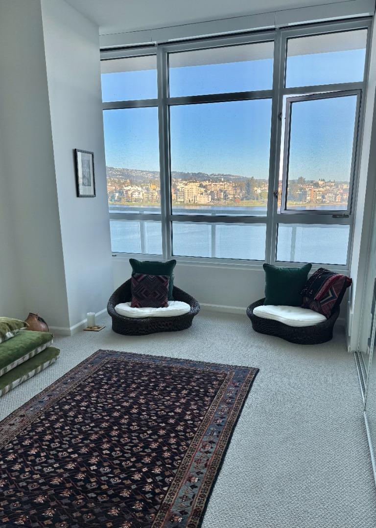 1 Lakeside Drive, Unit 602 Oakland, CA 94612 - Photo 15 of 26 a living room with a couch and a table