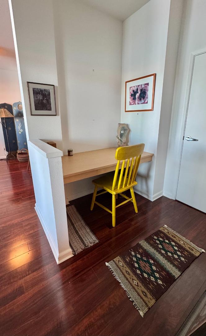 1 Lakeside Drive, Unit 602 Oakland, CA 94612 - Photo 16 of 26 a living room with wooden floor and furniture