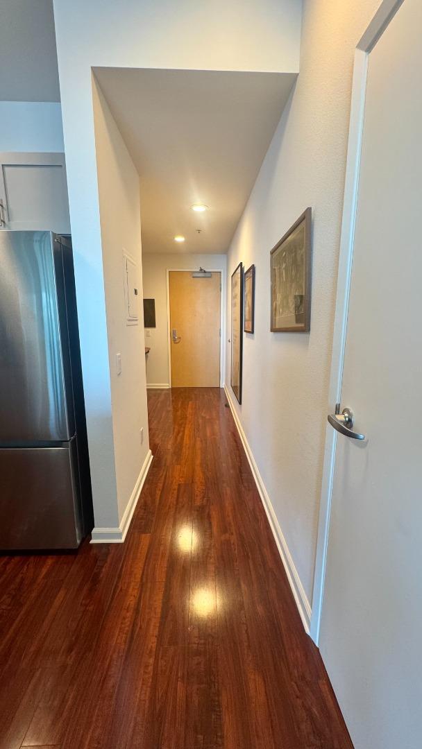 1 Lakeside Drive, Unit 602 Oakland, CA 94612 - Photo 6 of 26 a view of hallway with wooden floor