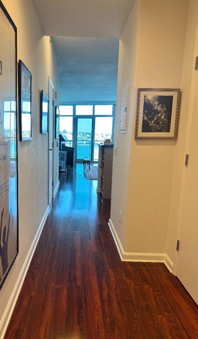 1 Lakeside Drive, Unit 602 Oakland, CA 94612 - Photo 7 of 26 wooden floor in an empty room with a window