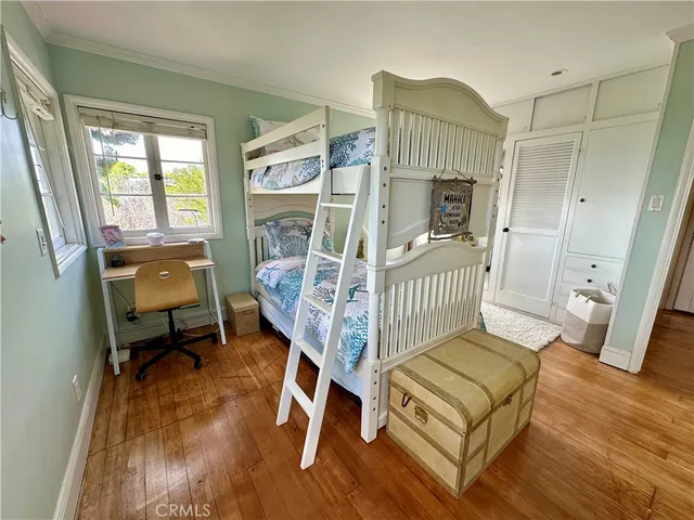 a living room with furniture a fireplace and a wooden floor