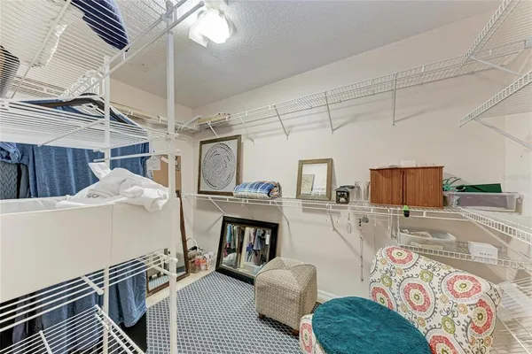 a view of a livingroom with a ceiling fan and window