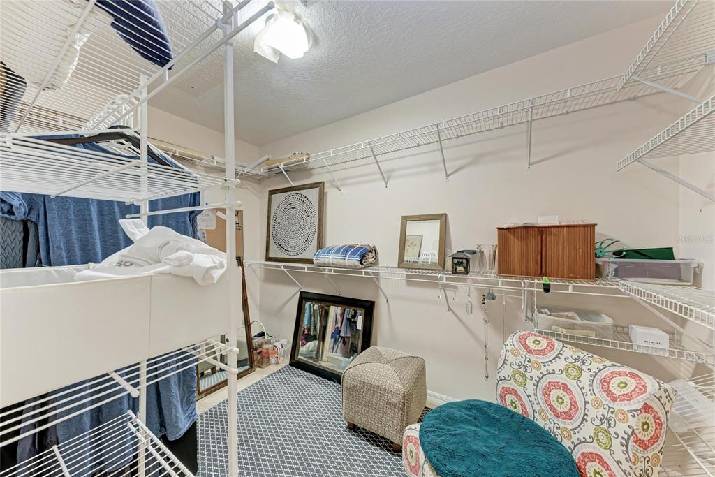 4906 Peridia Boulevard East Bradenton, FL 34203 - Photo 24 of 64 a living room with furniture and a flat screen tv