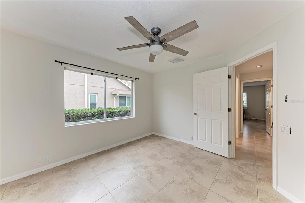 4906 Peridia Boulevard East Bradenton, FL 34203 - Photo 29 of 64 a view of a livingroom with a ceiling fan and window