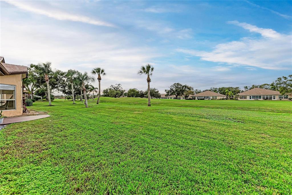 4906 Peridia Boulevard East Bradenton, FL 34203 - Photo 38 of 64 a view of a golf course with a garden