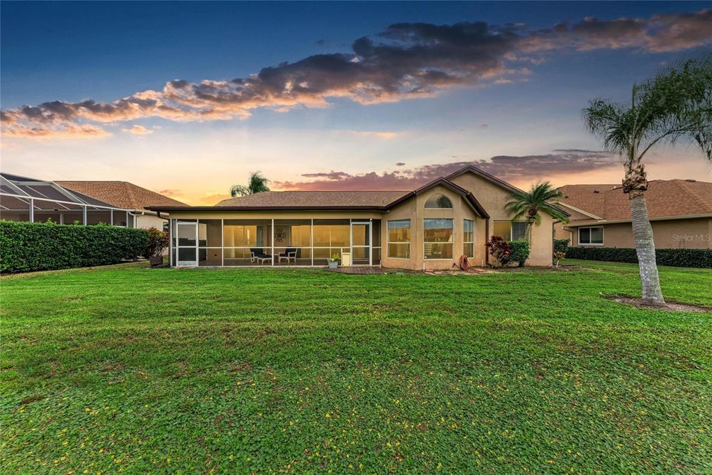 4906 Peridia Boulevard East Bradenton, FL 34203 - Photo 42 of 64 a view of a house with a yard