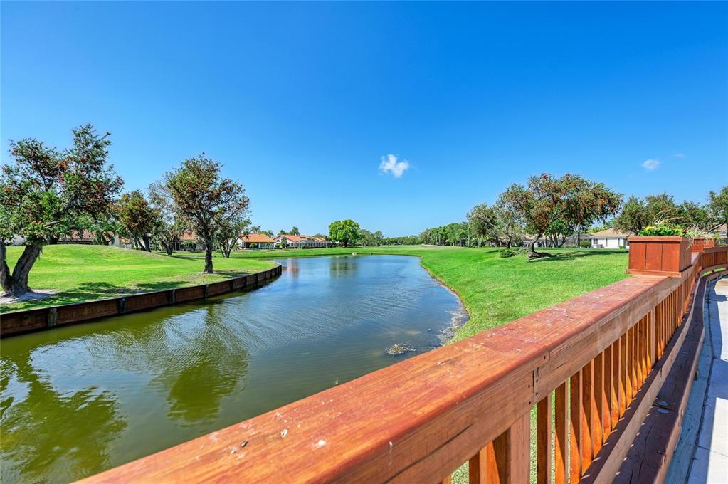 4906 Peridia Boulevard East Bradenton, FL 34203 - Photo 64 of 64 a view of a lake with a big yard