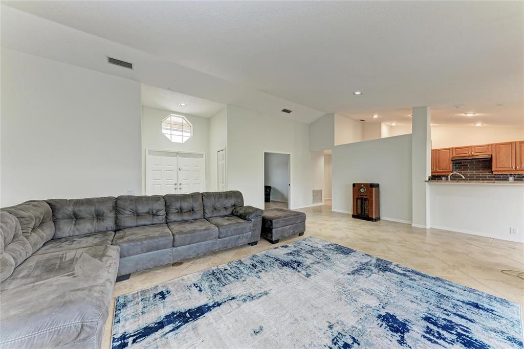 4906 Peridia Boulevard East Bradenton, FL 34203 - Photo 8 of 64 a living room with furniture and a couch