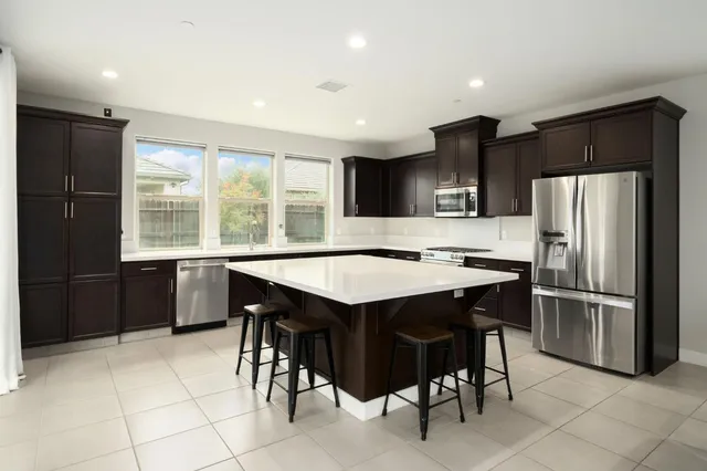 a kitchen with a sink and a window