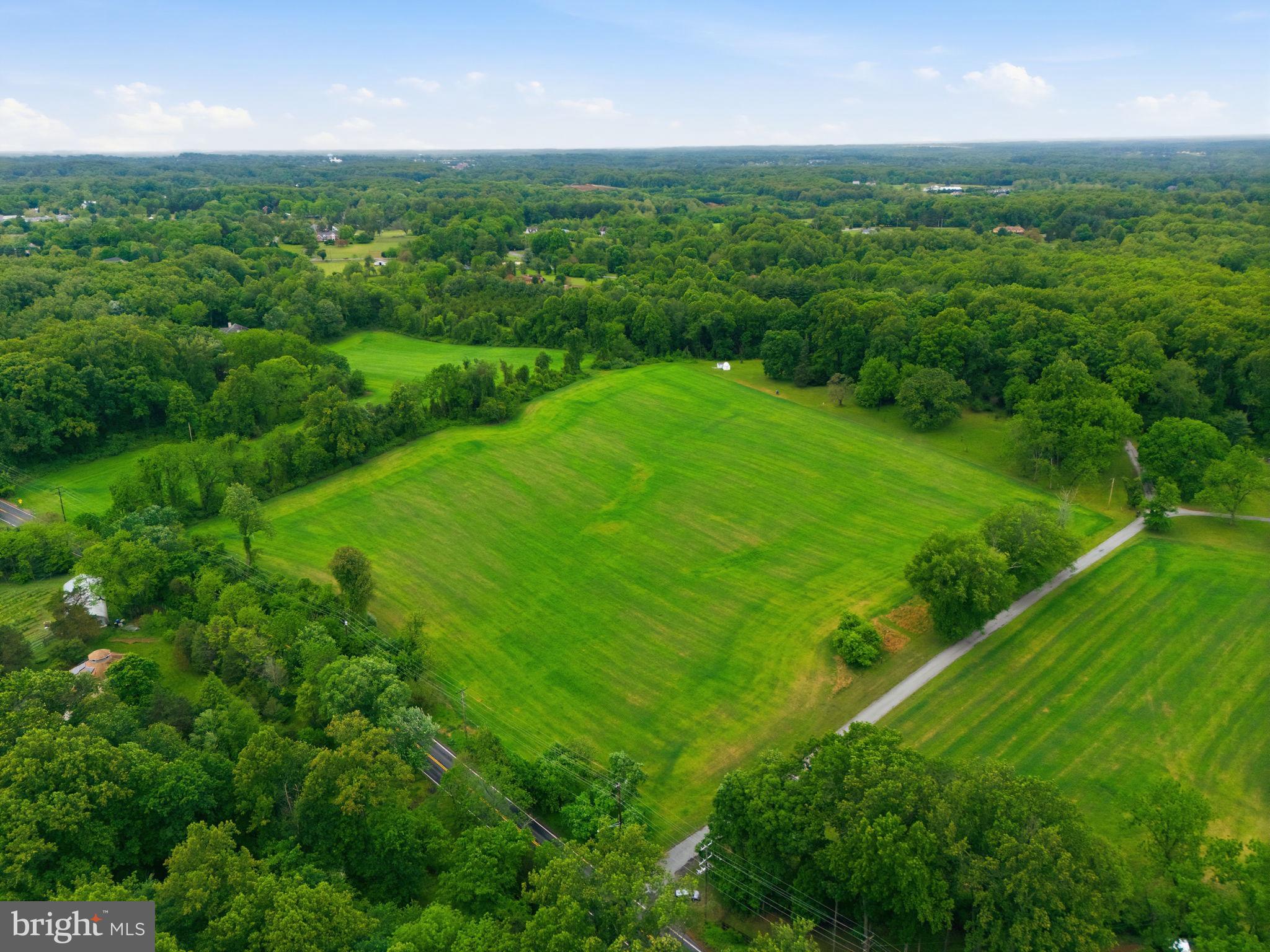 250 Ashton Road Ashton, MD 20861 - Photo 3 of 11 an aerial view of huge green field with lots of bushes