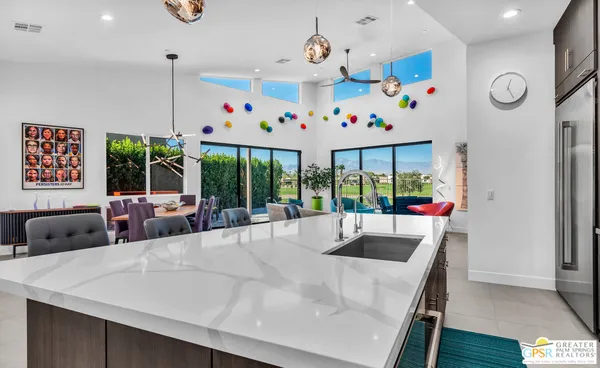 a large kitchen with a table and chairs