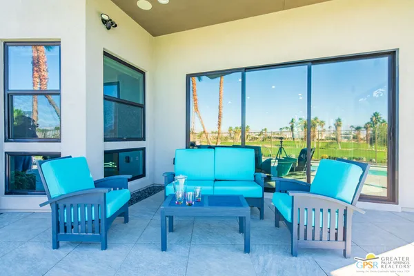 a view of a dining room with furniture window and outside view