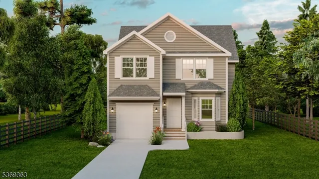 a front view of a house with a yard and green space