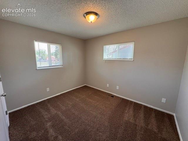 1922 Monterey Road Colorado Springs, CO 80910 - Photo 14 of 21 an empty room with a window