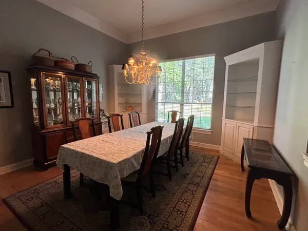 a view of a dining room with furniture window and outside view