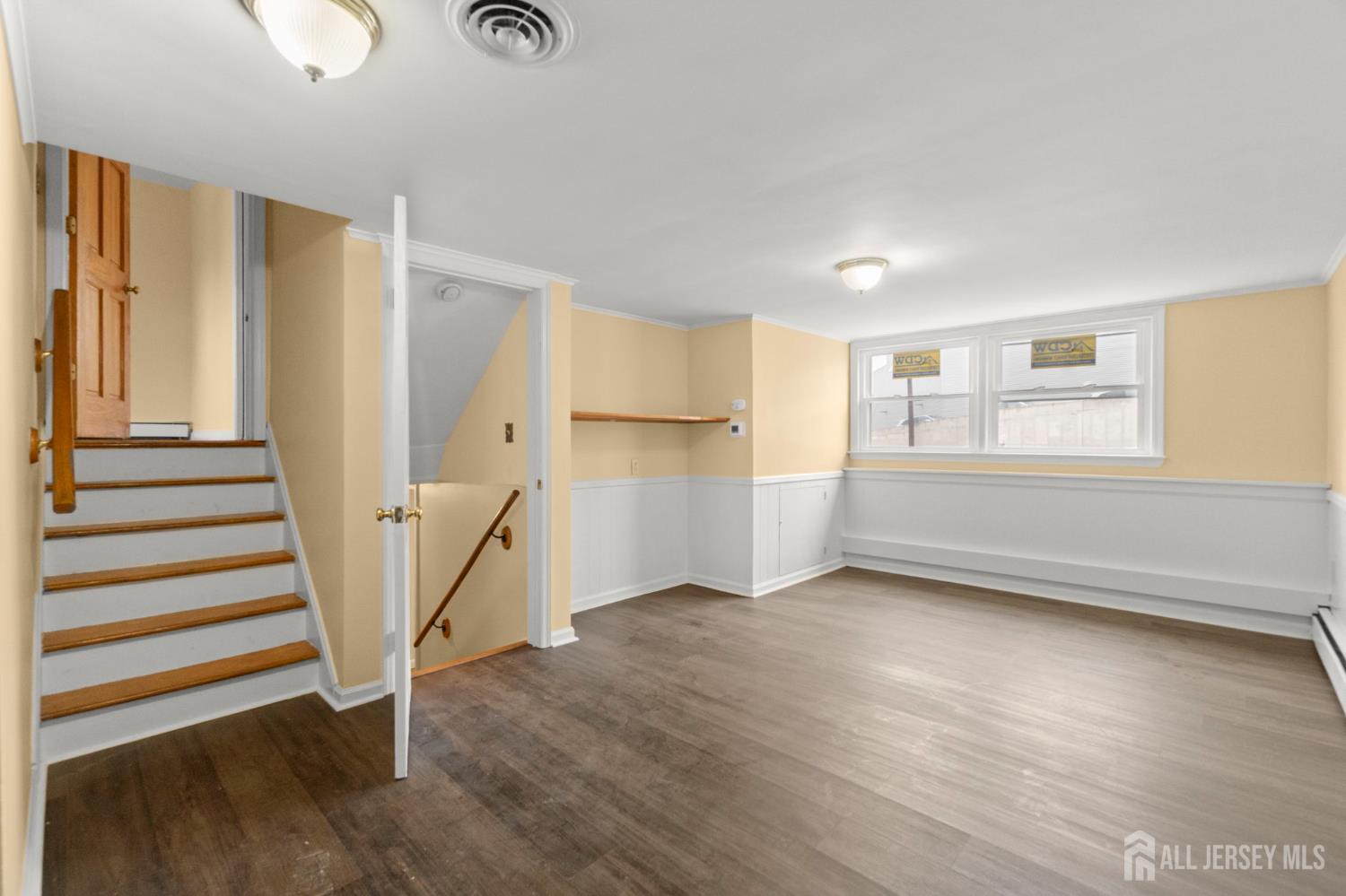 762 Valley Street Maplewood, NJ 07040 - Photo 21 of 21 wooden floor in an empty room with a window and wooden floor