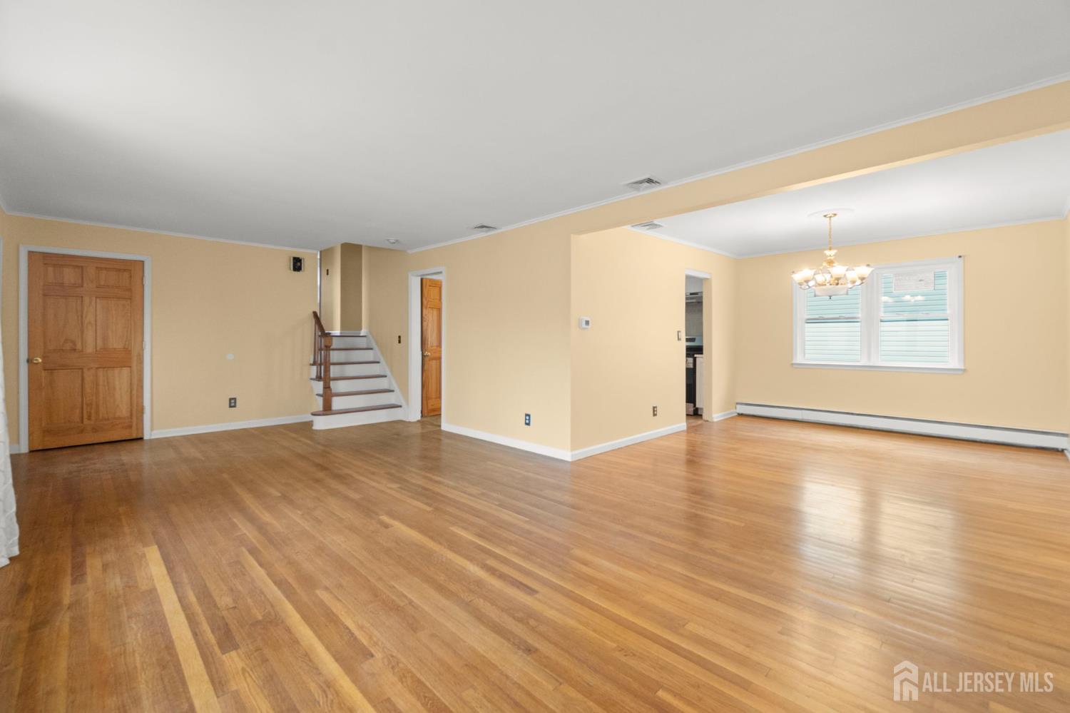 762 Valley Street Maplewood, NJ 07040 - Photo 5 of 21 an empty room with wooden floor and windows