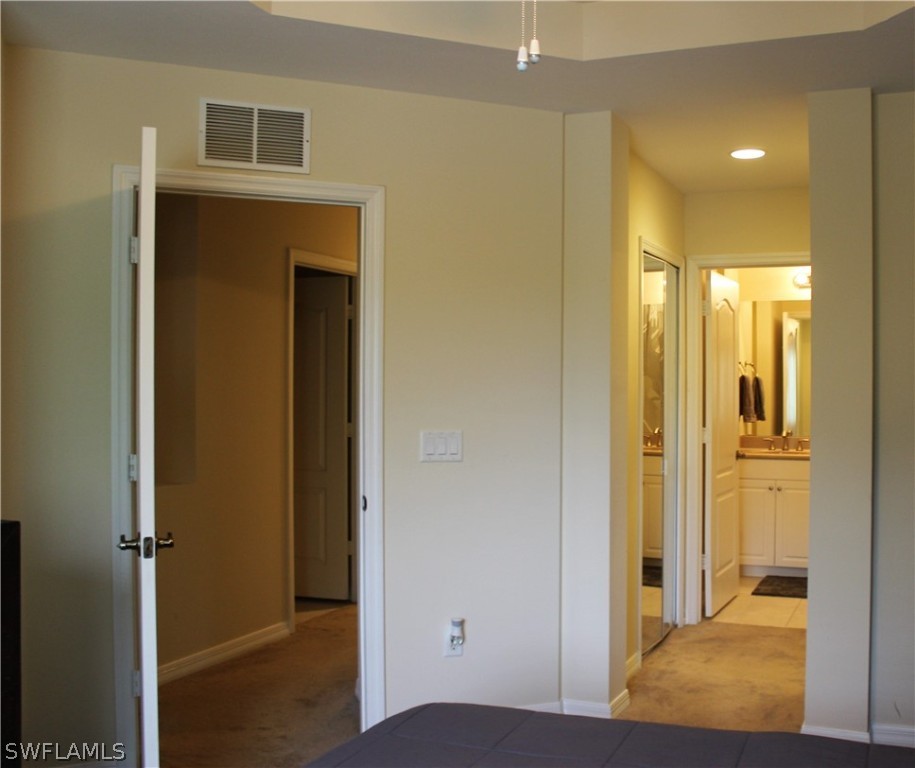 10190 Tin Maple Drive, Unit 130 Estero, FL 33928 - Photo 11 of 17 a view of a bathroom with a shower and a sink