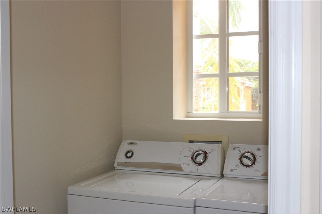 10190 Tin Maple Drive, Unit 130 Estero, FL 33928 - Photo 13 of 17 a bathroom with a toilet and a window
