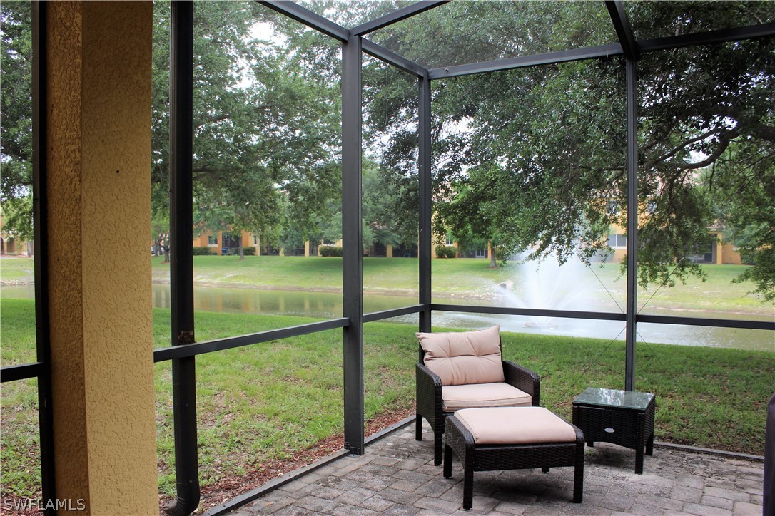 10190 Tin Maple Drive, Unit 130 Estero, FL 33928 - Photo 16 of 17 a view of a porch with furniture and garden