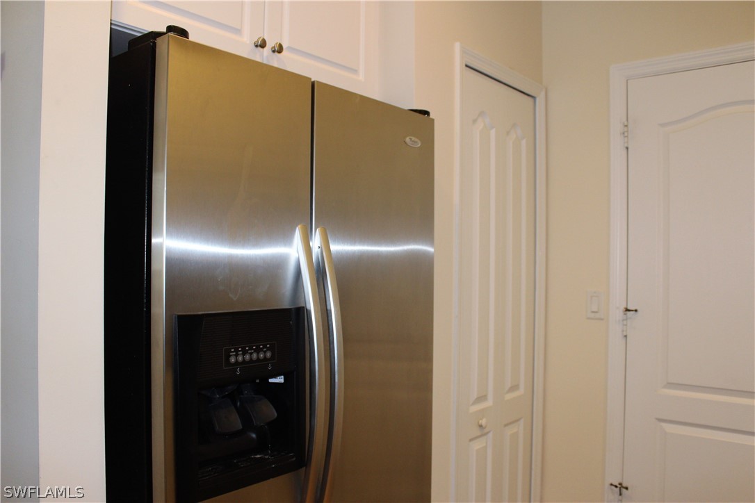 10190 Tin Maple Drive, Unit 130 Estero, FL 33928 - Photo 5 of 17 a bathroom with a glass shower door and sink