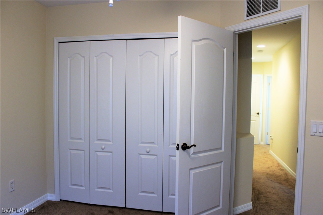 10190 Tin Maple Drive, Unit 130 Estero, FL 33928 - Photo 9 of 17 a view of a closet