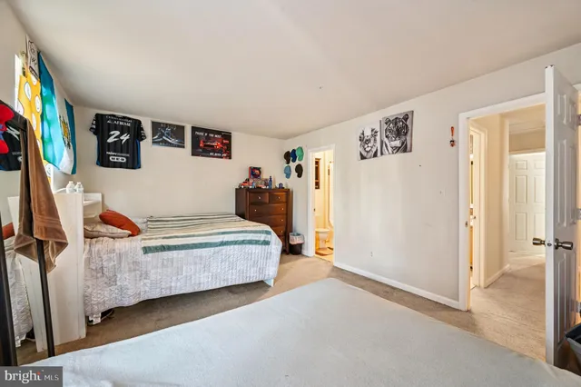 a bedroom with a bed and a couch