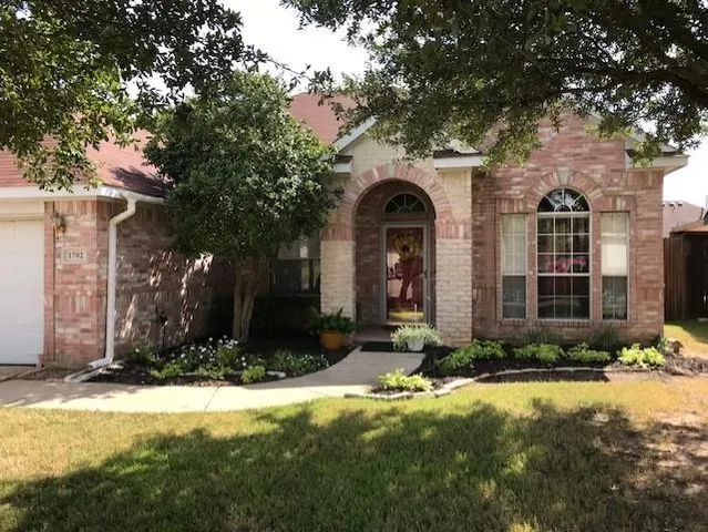 a front view of house with yard