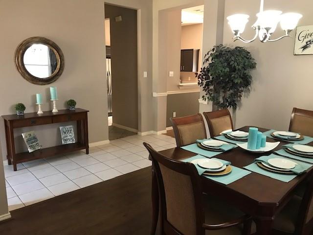 1702 Sunflower Drive Corinth, TX 76210 - Photo 11 of 12 a view of a dining room with furniture