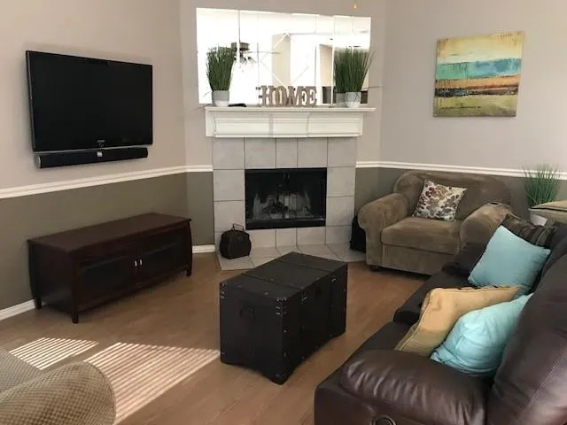 a living room with furniture and a flat screen tv
