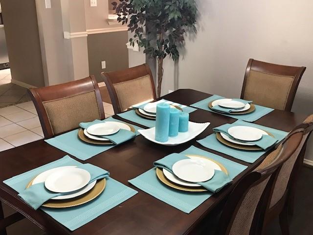 1702 Sunflower Drive Corinth, TX 76210 - Photo 10 of 12 a view of a dining room with furniture