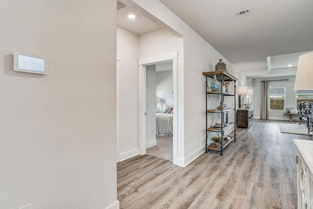 7637 Saddlebrook Avenue Pace, FL 32571 - Photo 3 of 28 a view of empty room with wooden floor